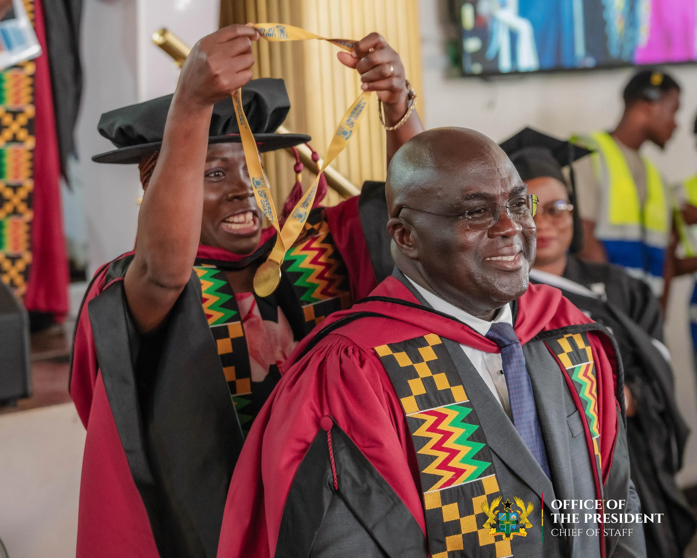 Receiving his medal in doctoral robes