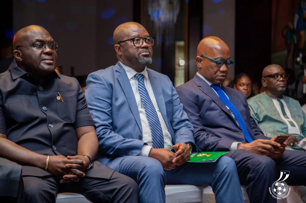 Julius Debrah seated beside Ghana Football Association President Kurt Okraku