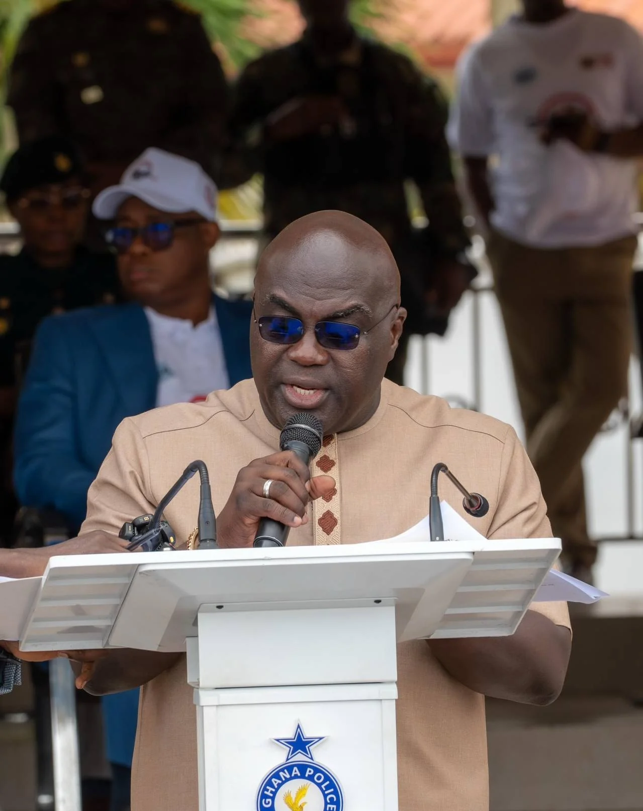 Dr. Julius Debrah speaking at a Ghana Police Service lectern